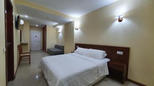 Cama o camas de una habitación en Sun Galicia Hotel y Apartamentos
