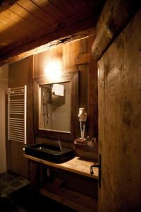 Ванна кімната в Chalet Svizzero Apartments