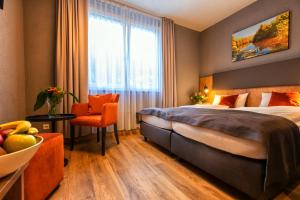 Postel nebo postele na pokoji v ubytování Hotel La Mirabelle close to Europa Park