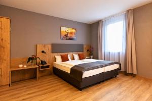 Postel nebo postele na pokoji v ubytování Hotel La Mirabelle close to Europa Park