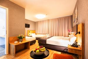 Postel nebo postele na pokoji v ubytování Hotel La Mirabelle close to Europa Park