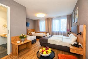 Postel nebo postele na pokoji v ubytování Hotel La Mirabelle close to Europa Park