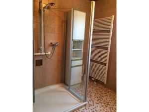 a shower with a glass door in a bathroom at Ferienhaus Johanna in Andernach