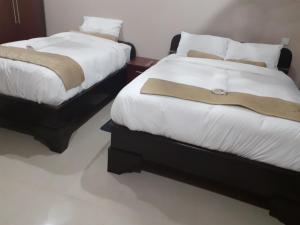 Postel nebo postele na pokoji v ubytování Delight Lodge