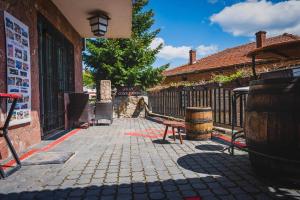 a patio with a bench next to a building at Villa Clock Tower - Саат Кула in Ohrid