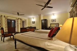 a large bedroom with two beds and a lamp at Roop Niwas Kothi, Near Mandawa in Nawalgarh +89 photos