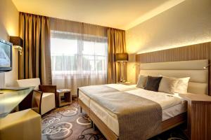 Postel nebo postele na pokoji v ubytování NordWest-Hotel Bad Zwischenahn