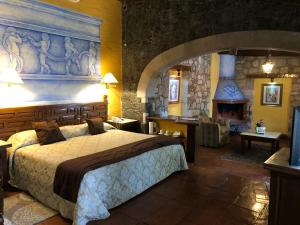 Postelja oz. postelje v sobi nastanitve Villa San Jose Hotel & Suites