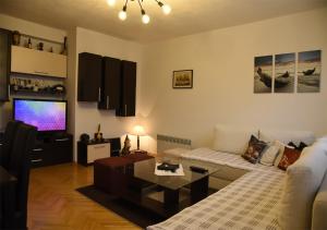 Μια τηλεόραση ή/και κέντρο ψυχαγωγίας στο Vero Comfort Apartment