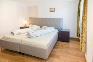 Postel nebo postele na pokoji v ubytování Hotel Reich