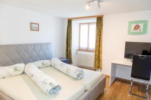 Postel nebo postele na pokoji v ubytování Hotel Reich