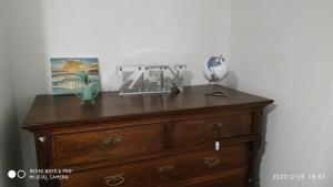 a wooden dresser with a lamp on top of it at Casa de la Abuela en el Camino de Santiago a Finiesterre in Negreira