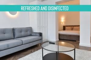 a living room with a couch and a coffee table at Luxury Studio next to Monte Carlo in Beausoleil