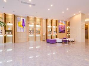 a large dressing room with gold walls and purple furniture at Lavande Hotel Chongqing Jiangbei Intemational Airport Teminal T3 Shop in Chongqing