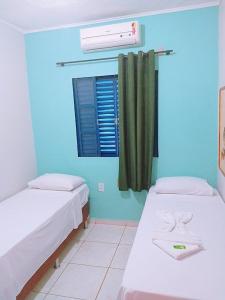 Una cama o camas en una habitación de Hotel Ypê