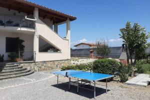 a blue ping pong table in front of a house at APPARTAMENT '' IL GIARDINO '' in Santa Maria La Carità