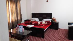 Postel nebo postele na pokoji v ubytování Kunhar View Hotel