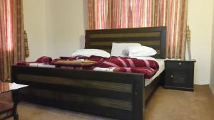 Postel nebo postele na pokoji v ubytování Kunhar View Hotel