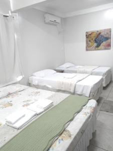 A bed or beds in a room at Hotel Araguaia Goiânia