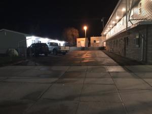 a truck parked in a parking lot at night at Townhouse Motel in Lusk