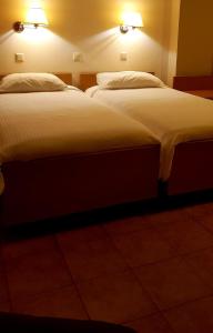 Posteľ alebo postele v izbe v ubytovaní Castella Beach