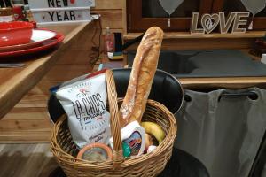 a basket filled with food in a kitchen at Charme Z'Aisne in Louâtre