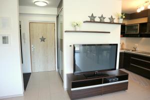 a living room with a flat screen tv at Panorama Donovaly 42-C in Donovaly