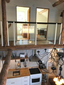 a kitchen with a large window in a house at Seaside Cottage House nr 1, Saltvik Hudiksvall in Hudiksvall +6 photos