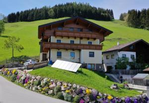 a house with a garden in front of it at Haus Erika in Wagrain