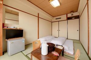 Kuchyň nebo kuchyňský kout v ubytování Hotel Oumiya