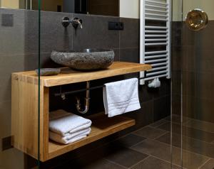 a bathroom with a sink and a shower at Apartments Riega in Sesto