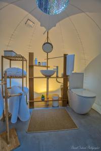 Voodi või voodid majutusasutuse Bubble Lodge Bois Chéri Plantation toas