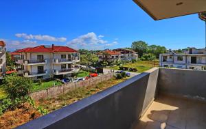 a view from the balcony of a apartment building at Katerina Apartments in Keramotí