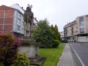 a statue on the side of a street at Casa de la Abuela en el Camino de Santiago a Finiesterre in Negreira