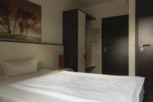 Postel nebo postele na pokoji v ubytování Schlüter Hotel & Restaurant