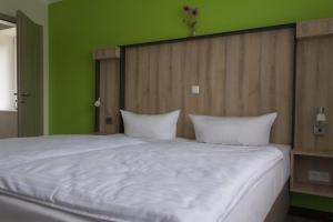 Postel nebo postele na pokoji v ubytování Schlüter Hotel & Restaurant