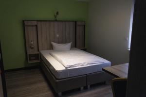 Postel nebo postele na pokoji v ubytování Schlüter Hotel & Restaurant