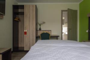 Postel nebo postele na pokoji v ubytování Schlüter Hotel & Restaurant