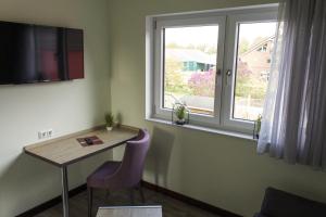 TV a/nebo společenská místnost v ubytování Schlüter Hotel & Restaurant