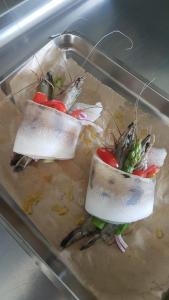 three pieces of food in a tray in an oven at Inselklause in Schonwald im Schwarzwald