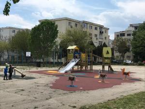 a playground with a slide and ducks in a park at Apartament Langa Plaja Diana in Mangalia