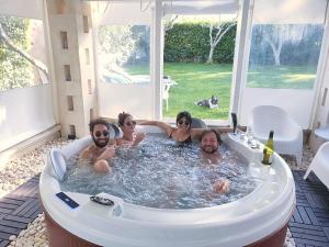 a group of people in a jacuzzi tub at B&B Brunone in Alberobello