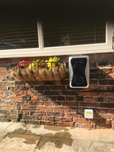 a traffic light on a brick wall with a window at The Old Surgery in Thirsk