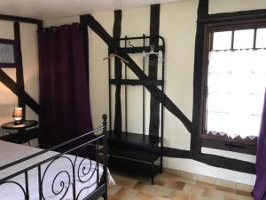 Postel nebo postele na pokoji v ubytování Gîtes Chambres d'hôtes Entre Terre & Mer