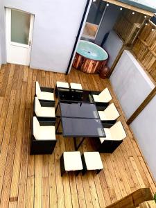 an overhead view of a table and chairs on a boat at Victory luxury hot tub house in Blackpool