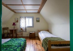 Postel nebo postele na pokoji v ubytování MorzeLas niebieski domek