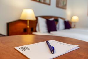 Postel nebo postele na pokoji v ubytování Hotel Münchwilen