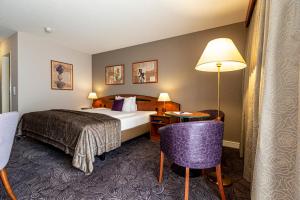 Postel nebo postele na pokoji v ubytování Hotel Münchwilen