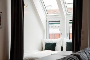Łóżko lub łóżka w pokoju w obiekcie Boutique Design-Apartments Vienna