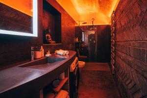 a small bathroom with a sink and a toilet at Ultra premium apartments in Český Krumlov